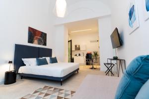 a bedroom with a bed and a tv in it at ORISPACE73 in Catania +29 photos