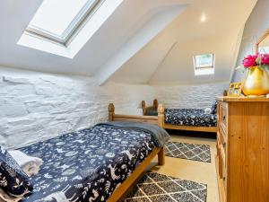 a bedroom with two beds in a attic at 3 Bed in Bude WVFCO in Ashwater