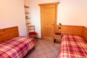 Posteľ alebo postele v izbe v ubytovaní Chalet Alberti