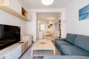 Televízia a/alebo spoločenská miestnosť v ubytovaní Apartamento Fuentecilla Céntrico