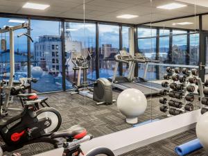 a gym with a view of a city at Ibis Styles Hobart in Hobart