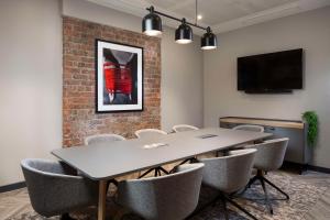 a conference room with a table and chairs at Radisson RED Hotel, Liverpool in Liverpool