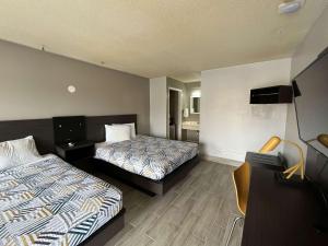 Katil atau katil-katil dalam bilik di Motel 6 Cordele, GA
