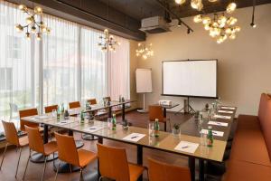 a conference room with a large table and chairs at Amedia Express Graz Airport, Trademark Collection by Wyndham in Feldkirchen bei Graz