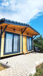 a log cabin with a patio in front of it at Chirali Eco Villa in Kemer