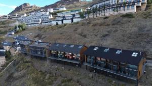 an aerial view of a building on a hill at Arttysur Lux Village Sierra Nevada Casa 8 Superlujo in Sierra Nevada