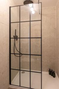 a shower with a glass door in a bathroom at Stunning Sea Views @ The Lido Lounge in Margate