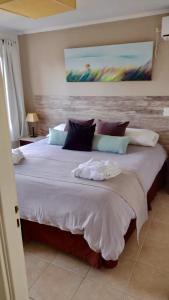 a bedroom with a large bed in a room at Jaina Resort & Spa in Mar de las Pampas +99 photos