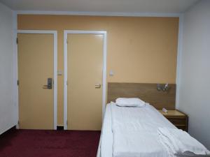 Postel nebo postele na pokoji v ubytování Hotel Evergreen