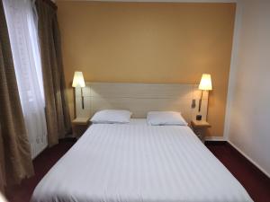 Postel nebo postele na pokoji v ubytování Hotel Evergreen