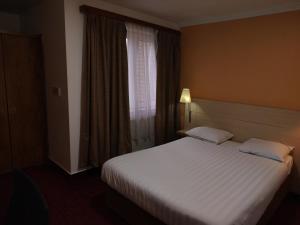 Postel nebo postele na pokoji v ubytování Hotel Evergreen