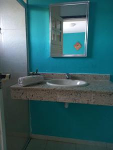 a bathroom counter with a sink and a mirror at Shanti Life in Búzios