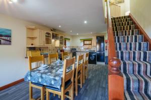 a kitchen and dining room with a table and chairs at Farm Cottage - Kirkby-In-Furness, ideal for the Central Lake District in Soutergate