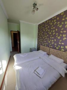 Voodi või voodid majutusasutuse Home Hotel toas
