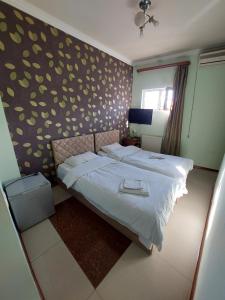 Voodi või voodid majutusasutuse Home Hotel toas