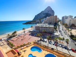 a view of a beach and buildings and the ocean at Apartment Zafiro 02 by Interhome in Calpe