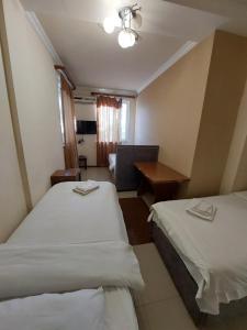 Voodi või voodid majutusasutuse Home Hotel toas