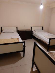 Voodi või voodid majutusasutuse Home Hotel toas