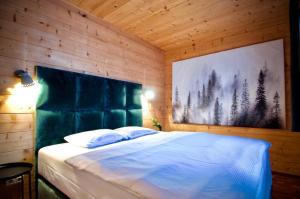 Ein Bett oder Betten in einem Zimmer der Unterkunft Almgasthof Windischgrätz