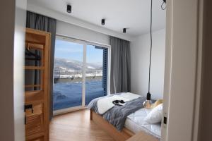 Una cama o camas en una habitación de Apartament Wisła Siglany