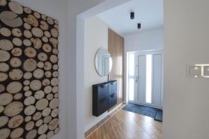 Una televisión o centro de entretenimiento en Apartament Wisła Siglany
