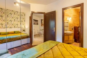 a bedroom with two beds and a bathroom at LU Apartment Eur in Rome