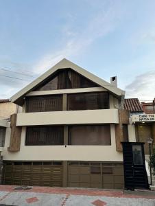 a house with a large garage at One Fourteen Rooms in Bogotá