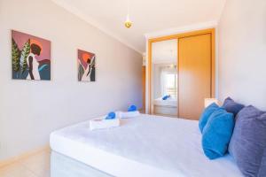 a bedroom with a large white bed in a room at Solymar Apartment in Guia +12 photos