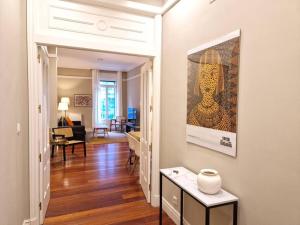 a living room with a painting on the wall at GRAN VÍA Bilbao by ALOHA Bilbao in Bilbao