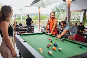 a group of people playing a game of pool at Chill Inn Samui Hostel and Restaurant in Koh Samui 