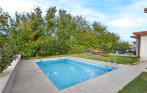 a swimming pool in the backyard of a house at 1 Bedroom Awesome Apartment In Catanzaro Lido in Catanzaro Lido