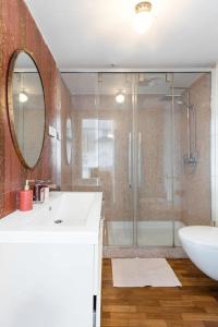 a bathroom with a shower and a sink and a mirror at Trastevere Attic Raffaello’s rooms in Rome