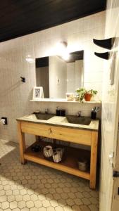 a bathroom with a sink and a mirror at Hostel Tandil in Tandil +16 photos