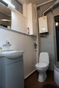 a bathroom with a toilet and a sink at Apartament Chorzów Centrum Wróblewskiego in Chorzów