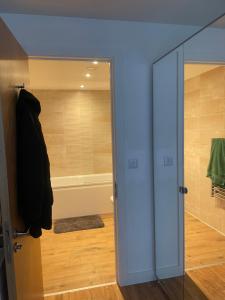 a glass door leading into a bathroom with a shower at Manchesters Home Like Home in Manchester