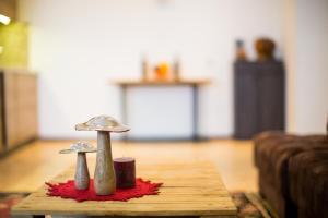 two mushrooms sitting on top of a wooden table at Saniba Gudauri in Gudauri