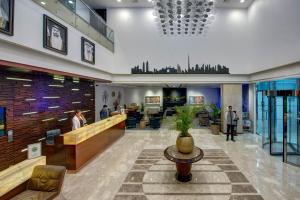 a lobby of a hospital with a waiting room at Grandeur Hotel Al Barsha in Dubai