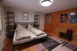 a bedroom with a bed with pillows on it at 4 Barga Blick in Partenen