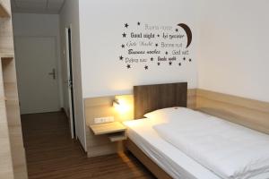 Postel nebo postele na pokoji v ubytování Hotel Baldus