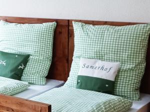 a couple of pillows sitting on a bed at Ferien am Samerhof in Matreiwald
