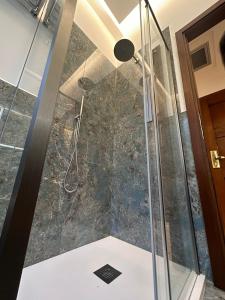 a shower with a glass door in a bathroom at Hotel Le Due Fontane in Florence