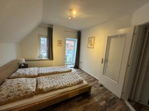Ένα ή περισσότερα κρεβάτια σε δωμάτιο στο RB City Apartments Emden am Wall 3