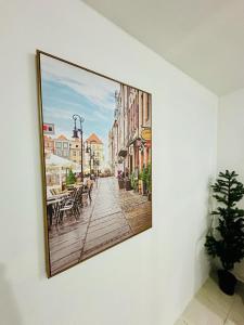 a picture on a wall with a picture of a street at Deluxe GIRLS HOSTEL in Dubai