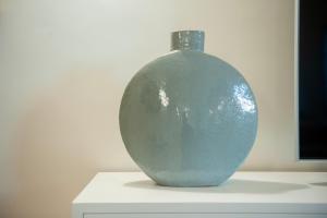 a blue vase sitting on a white table at Giotto Suite With View in Florence