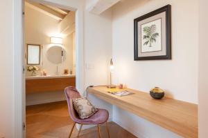 a home office with a desk and a chair at Giotto Suite With View in Florence
