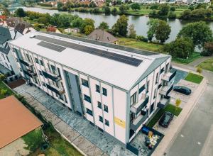 an overhead view of a building with solar panels on it at Main Boardinghouse in Erlenbach am Main