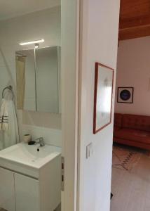 a bathroom with a sink and a mirror at Old Town Studios in Parga