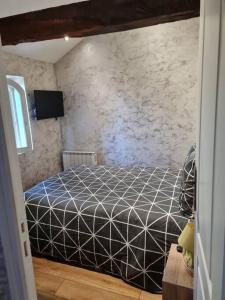 Postel nebo postele na pokoji v ubytování PETIT GÎTE 18 ème tout confort