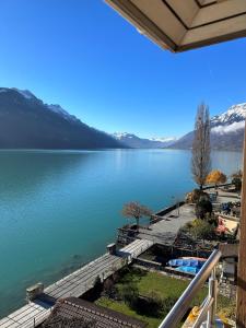 a view of a lake from a balcony at Hotel WALZ in Brienz