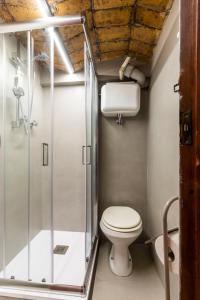 a bathroom with a toilet and a shower at FCR Rome Apartments Piazza Navona - Teatro Pace in Rome